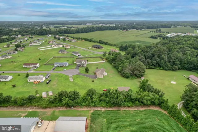 an aerial view of a houses with outdoor space and street view