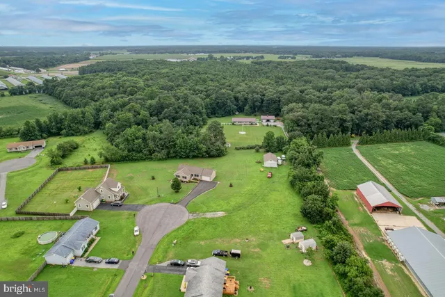 an aerial view of a golf course with parking space