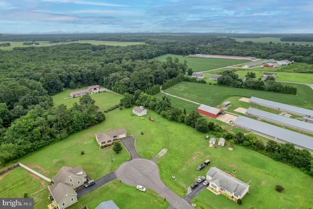 an aerial view of a golf course with parking space
