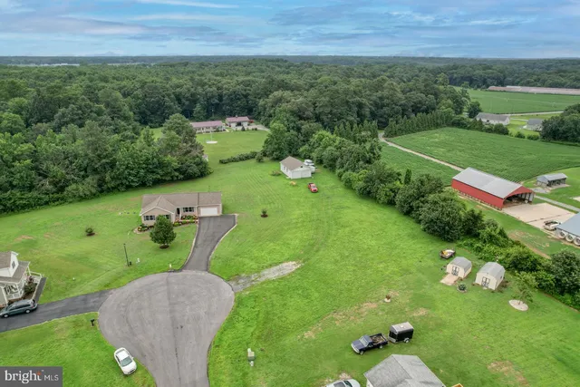 a view of a golf course with chairs