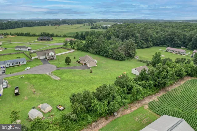 an aerial view of a golf course with parking space