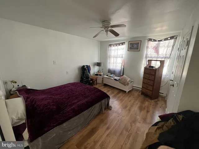 a bedroom with a bed and furniture