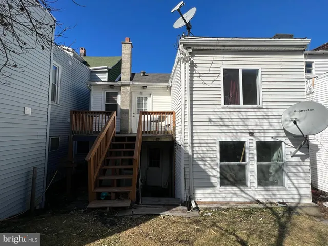 a front view of a house with stairs