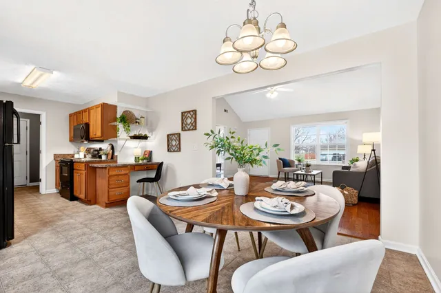 a kitchen with stainless steel appliances a stove a sink and a refrigerator
