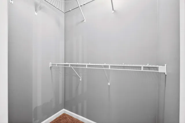 a view of a livingroom with a chandelier fan