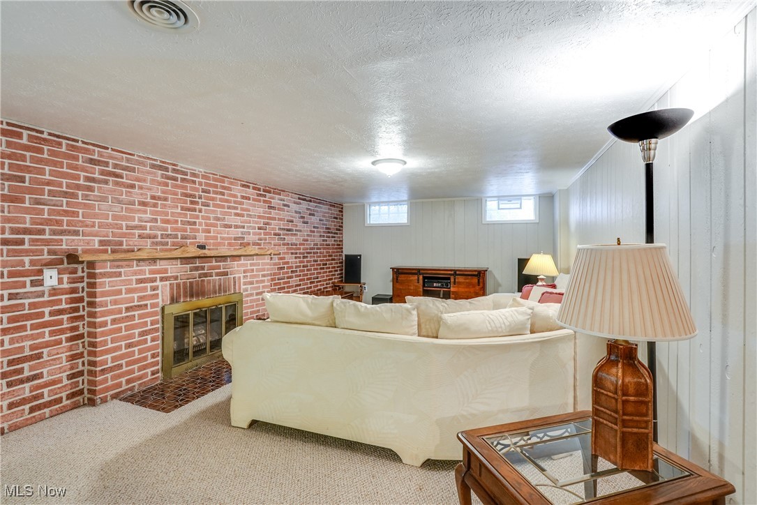 2488 Holgate Road Akron, OH 44313 - Photo 36 of 50 Recreation room with a woodburning fireplace.
