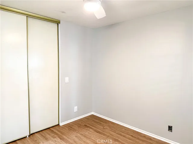 a view of a small space with wooden floor