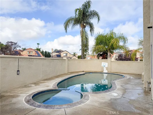 a view of a swimming pool with a lounge chairs