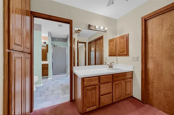 a bathroom with a double vanity sink and a mirror