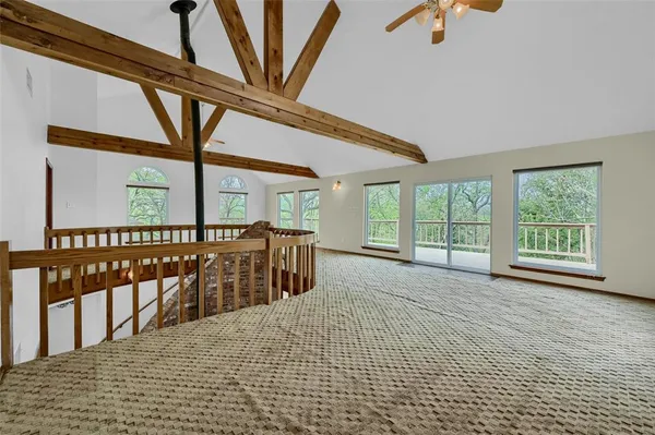 a view of an empty room with stairs