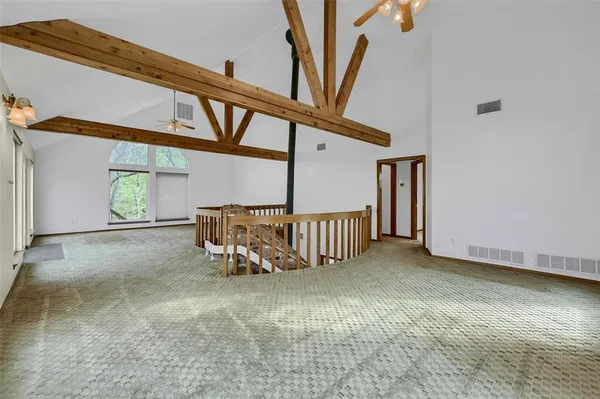 a view of a hallway with stairs