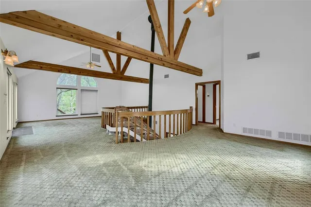 a view of a hallway with stairs