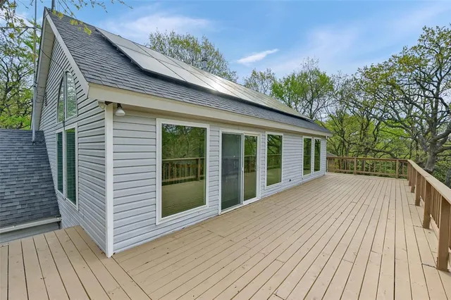 a view of balcony with wooden floor