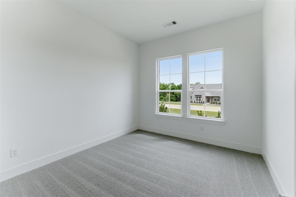 906 Perrin Lane Van Alstyne, TX 75495 - Photo 7 of 30 an empty room with a window