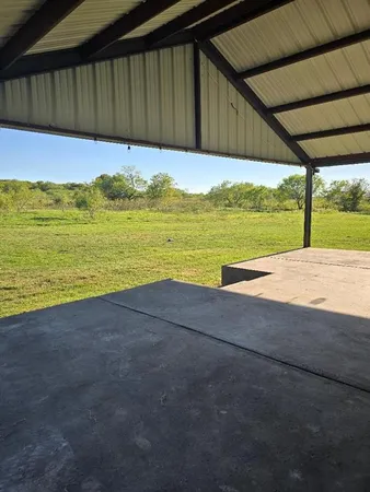 a view of ocean with a yard
