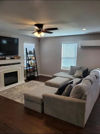 a kitchen with kitchen island granite countertop a sink cabinets and stainless steel appliances
