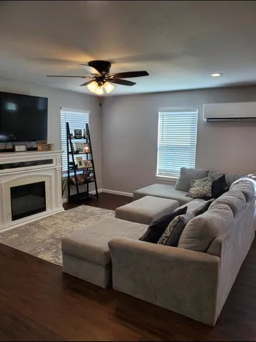 a kitchen with kitchen island granite countertop a sink cabinets and stainless steel appliances