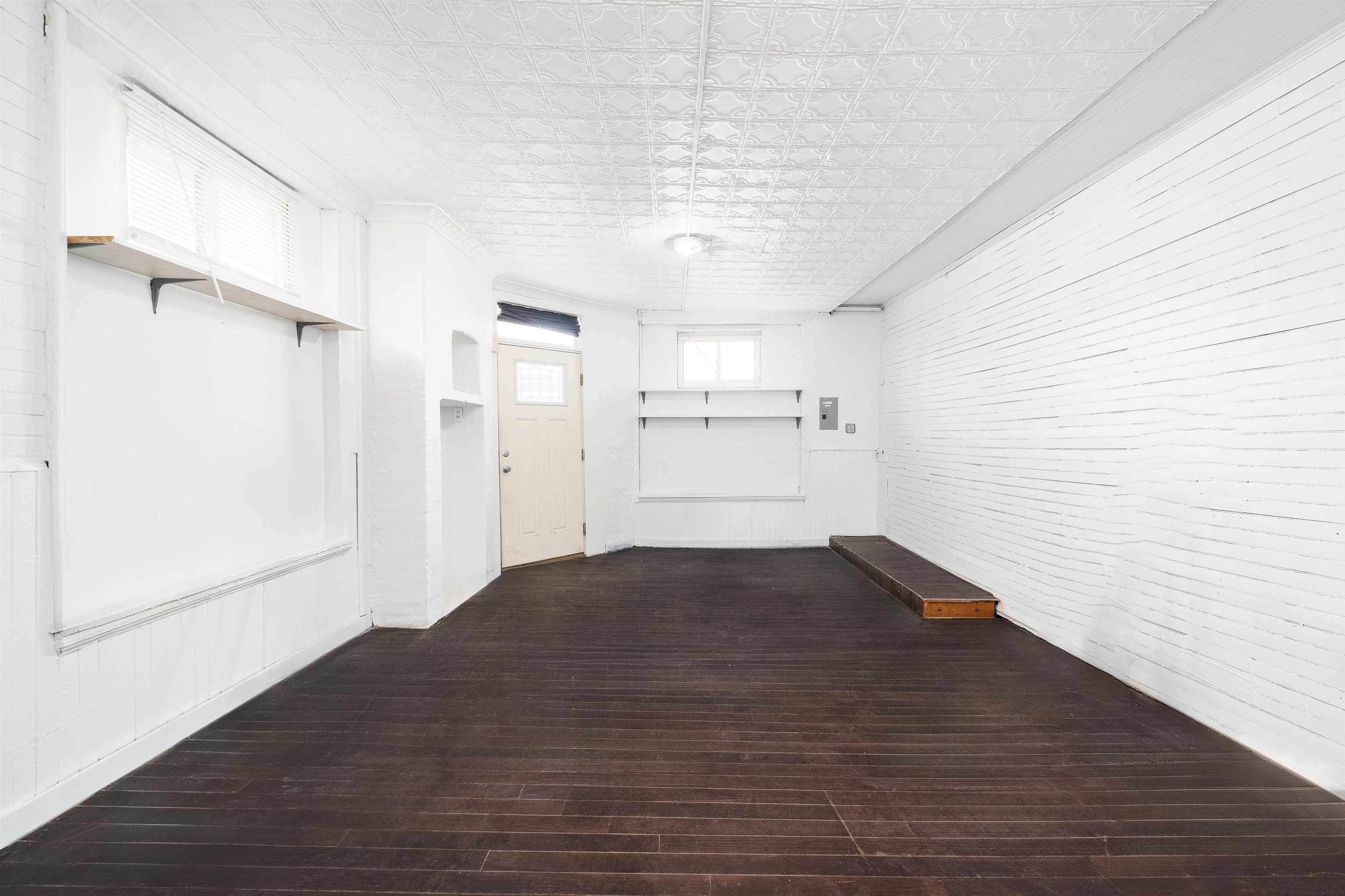 74 Colgate Street, Unit 1 Jersey City, NJ 07302 - Photo 2 of 12 a view of empty room with wooden floor and fan