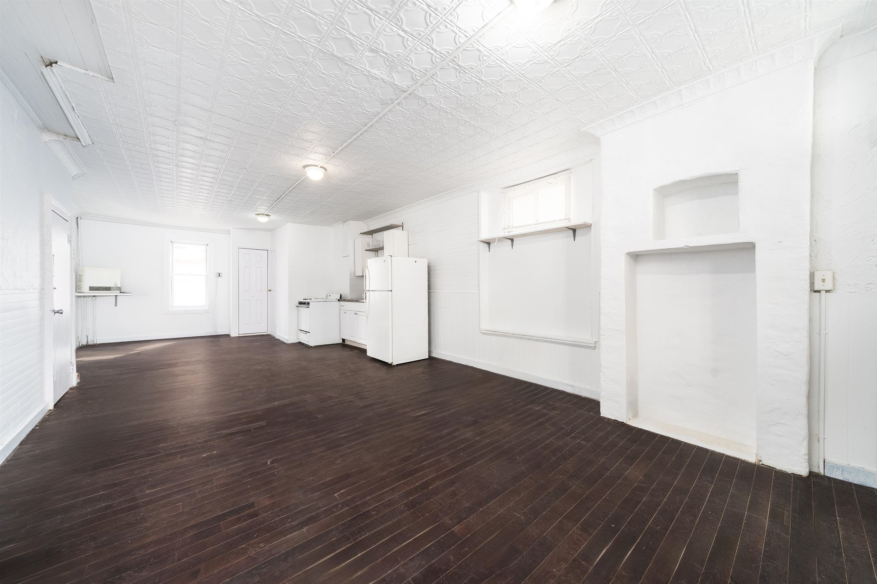 74 Colgate Street, Unit 1 Jersey City, NJ 07302 - Photo 4 of 12 a view of empty room with wooden floor