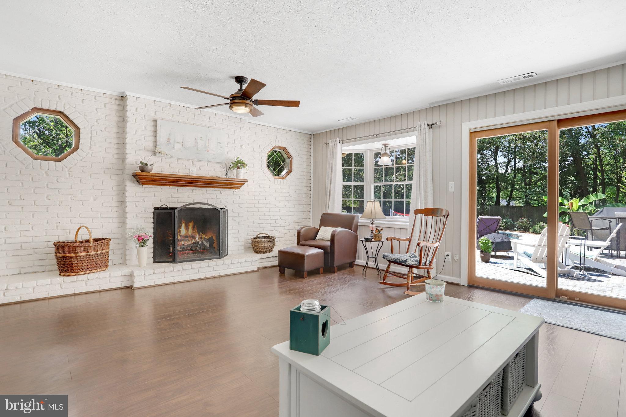 7057 Barbara Road Alexandria, VA 22315 - Photo 7 of 55 FAMILY ROOM WITH SLIDING GLASS DOOR TO POOL PATIO