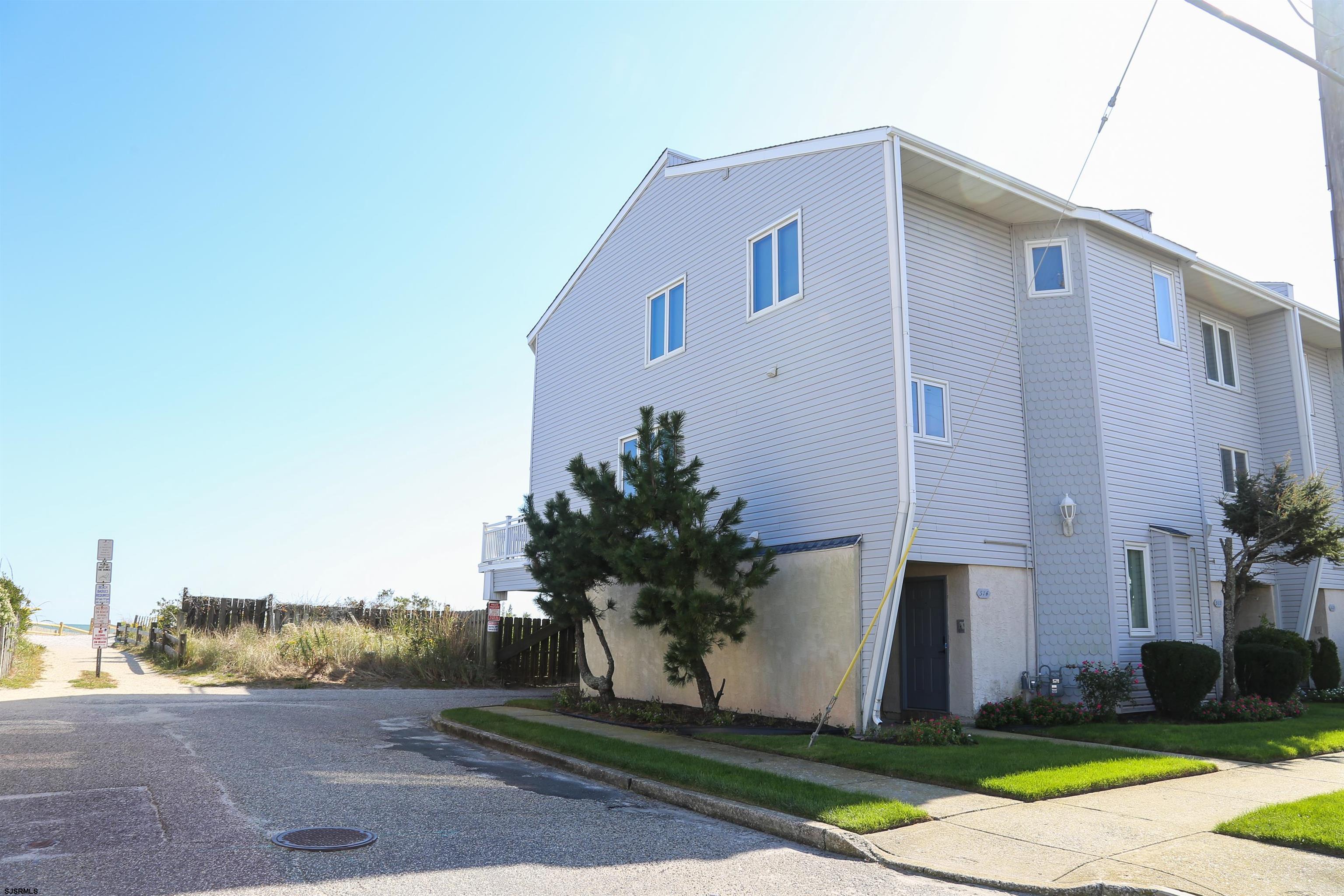 512 East Brigantine Avenue, Unit 512 Brigantine, NJ 08203 - Photo 13 of 46 a house that has a tree in front of it