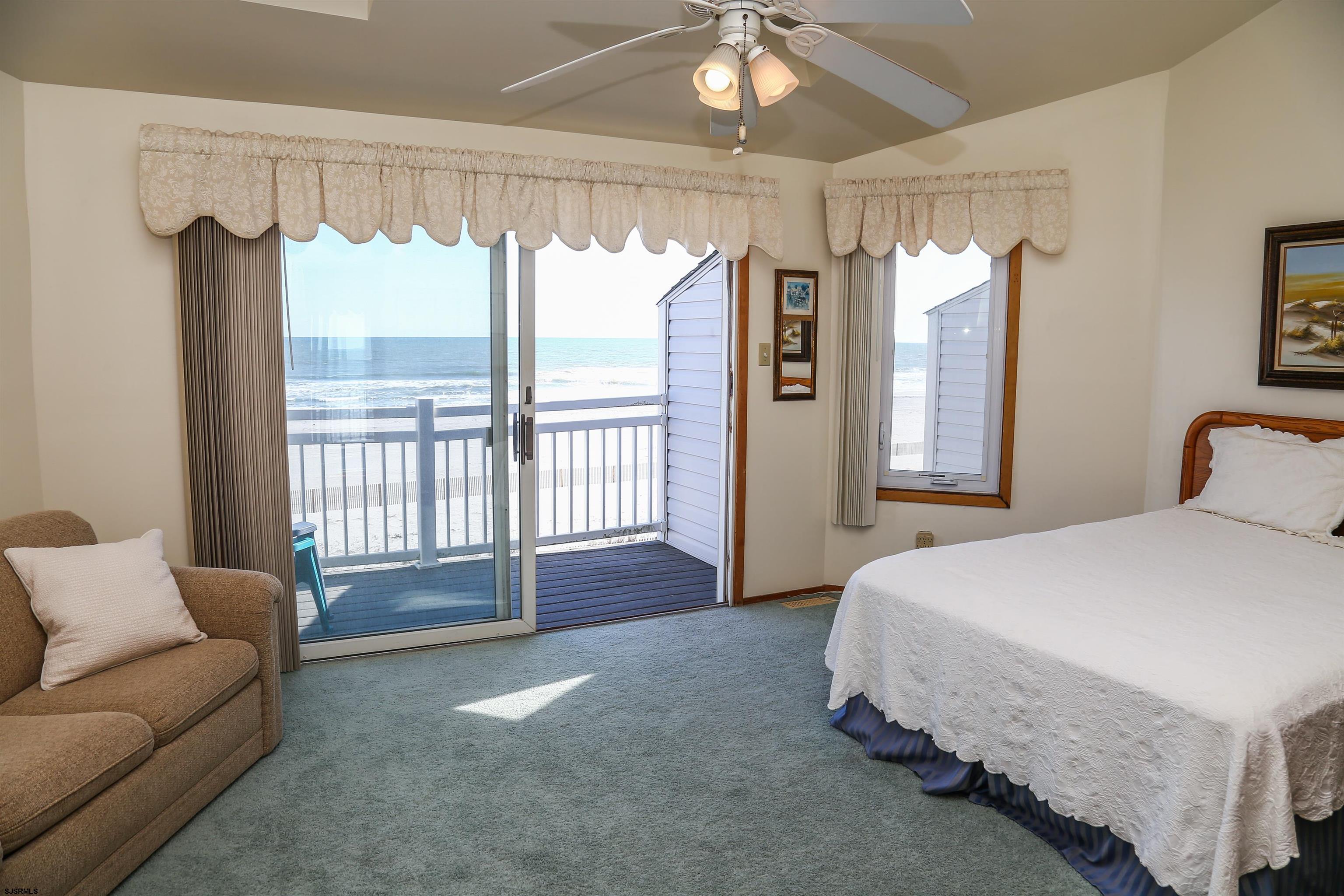 512 East Brigantine Avenue, Unit 512 Brigantine, NJ 08203 - Photo 15 of 46 a spacious bedroom with a bed and glass walk in closet