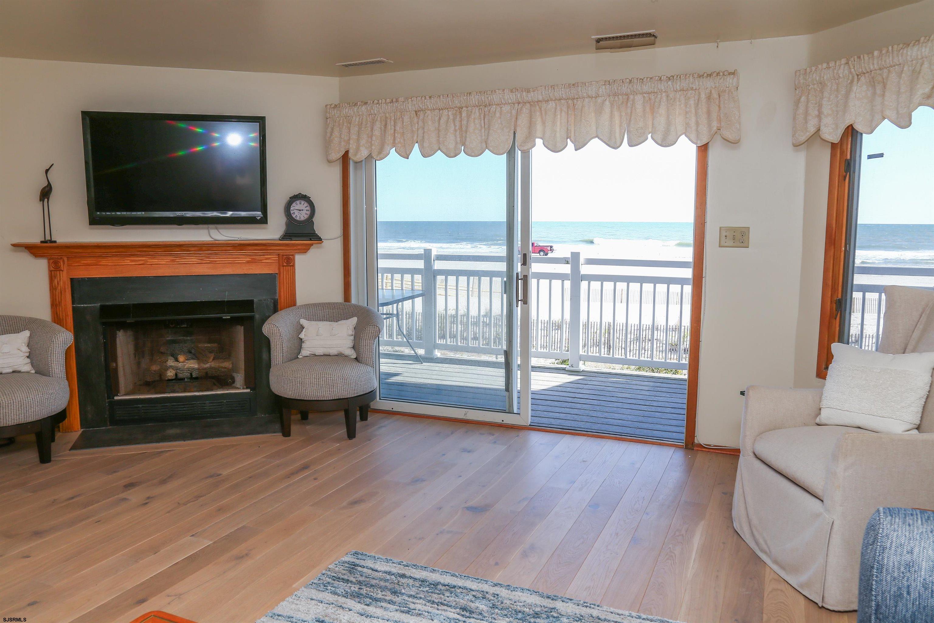512 East Brigantine Avenue, Unit 512 Brigantine, NJ 08203 - Photo 21 of 46 a living room with furniture and a fireplace