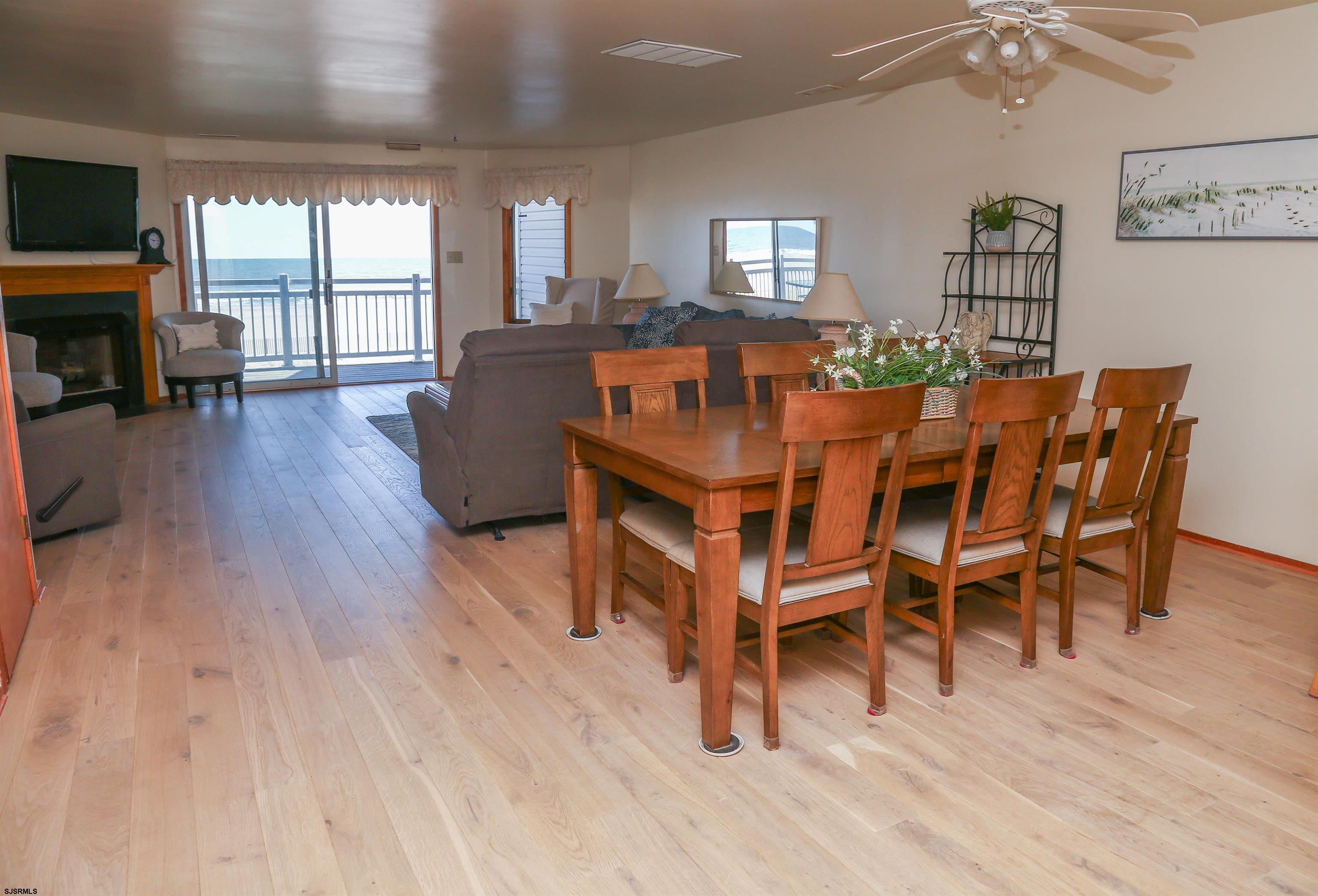 512 East Brigantine Avenue, Unit 512 Brigantine, NJ 08203 - Photo 23 of 46 a view of a dining room with furniture window and wooden floor