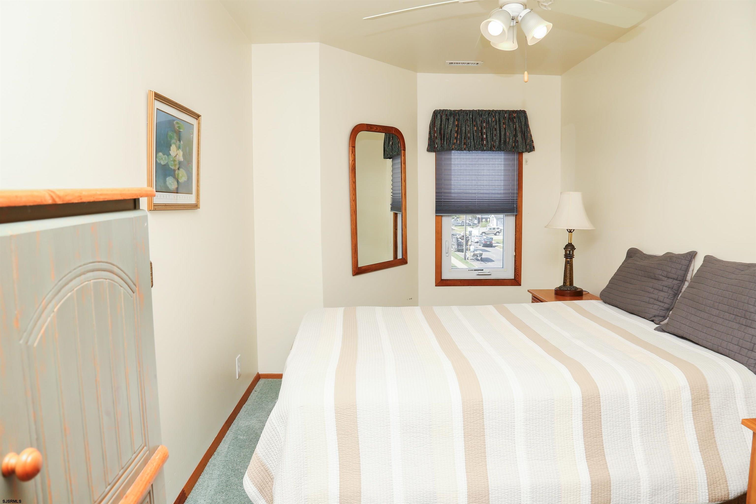 512 East Brigantine Avenue, Unit 512 Brigantine, NJ 08203 - Photo 29 of 46 a bedroom with bed and a window