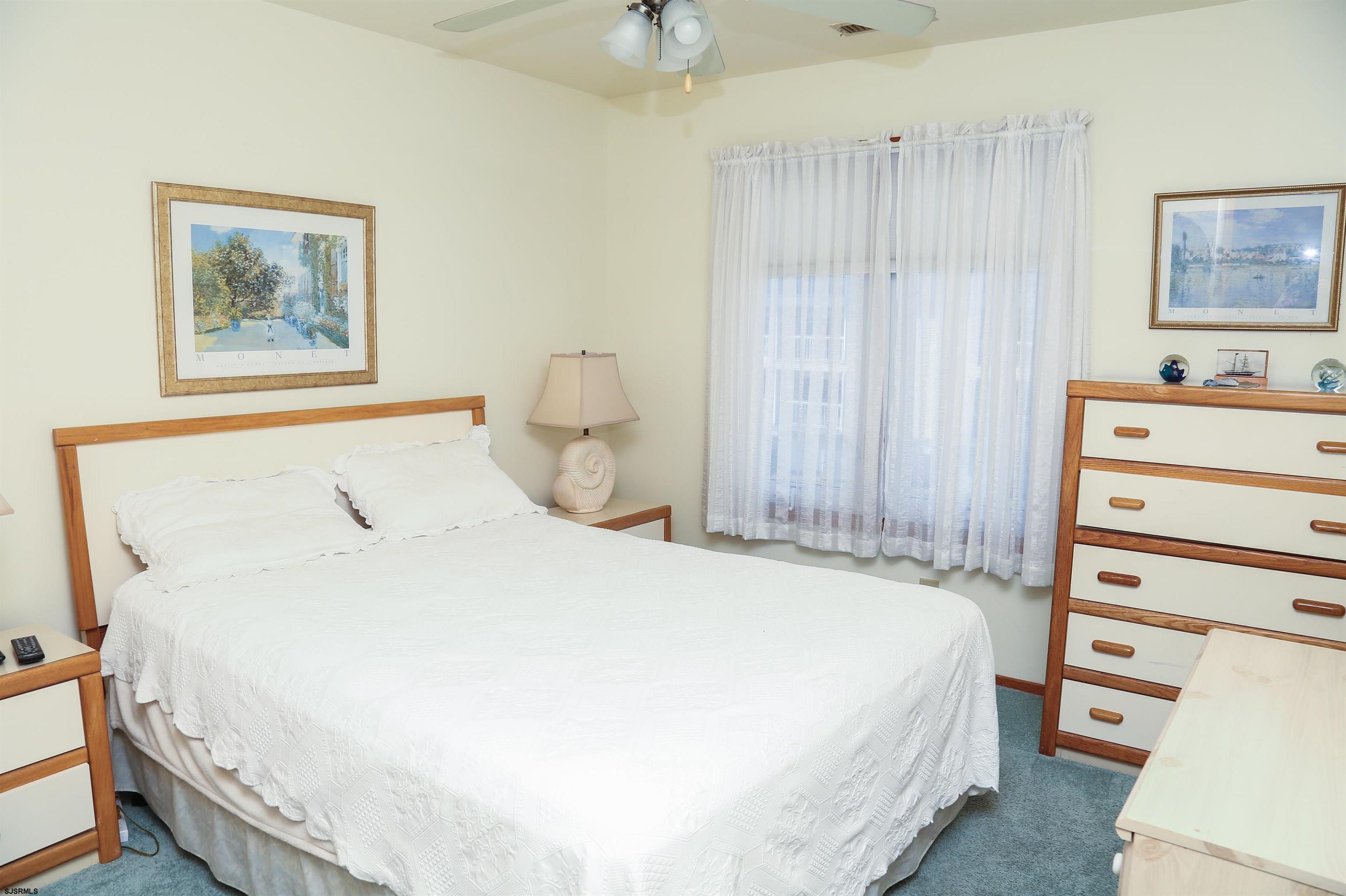 512 East Brigantine Avenue, Unit 512 Brigantine, NJ 08203 - Photo 30 of 46 a bedroom with a bed and a dresser