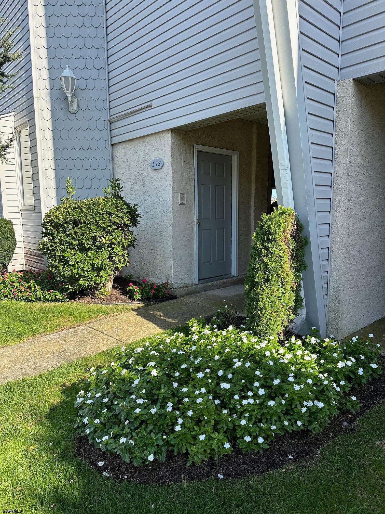 512 East Brigantine Avenue, Unit 512 Brigantine, NJ 08203 - Photo 43 of 46 a view of a house with potted plants