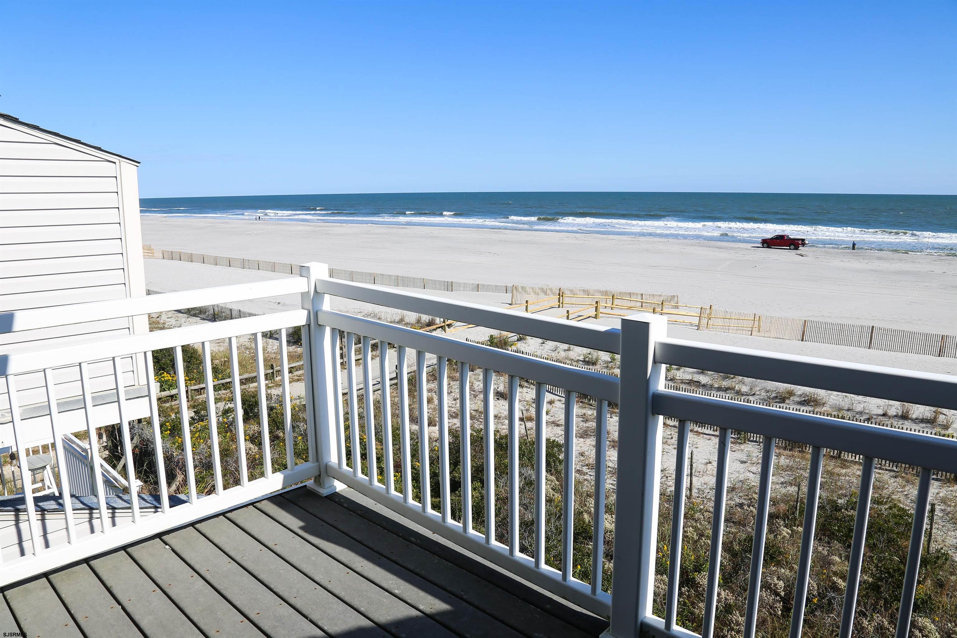 512 East Brigantine Avenue, Unit 512 Brigantine, NJ 08203 - Photo 8 of 46 a view of a balcony with wooden floor