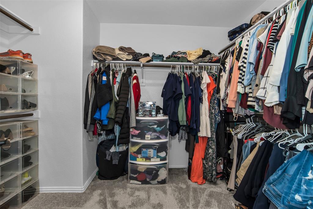 1566 Harrison Circle Waxahachie, TX 75165 - Photo 18 of 38 a view of walk in closet with clothes