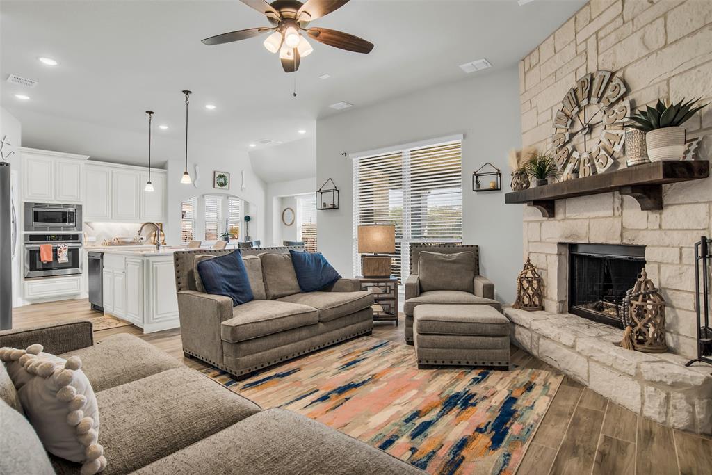 1566 Harrison Circle Waxahachie, TX 75165 - Photo 19 of 38 a living room with furniture and a fireplace