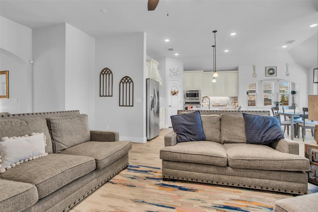 1566 Harrison Circle Waxahachie, TX 75165 - Photo 20 of 38 a living room with furniture and a view of kitchen