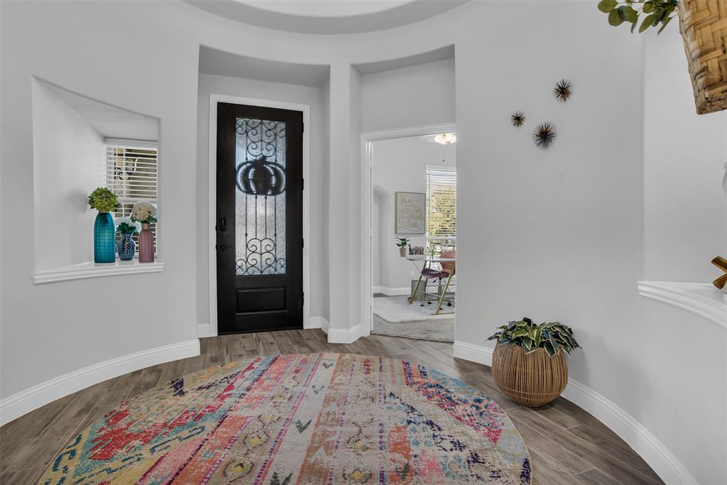 1566 Harrison Circle Waxahachie, TX 75165 - Photo 3 of 38 a bedroom with a bed and a window