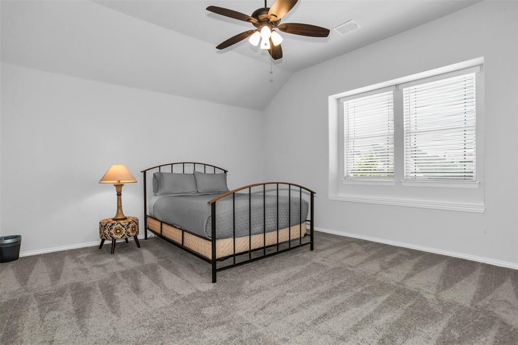 1566 Harrison Circle Waxahachie, TX 75165 - Photo 31 of 38 a view of a bedroom with furniture and windows