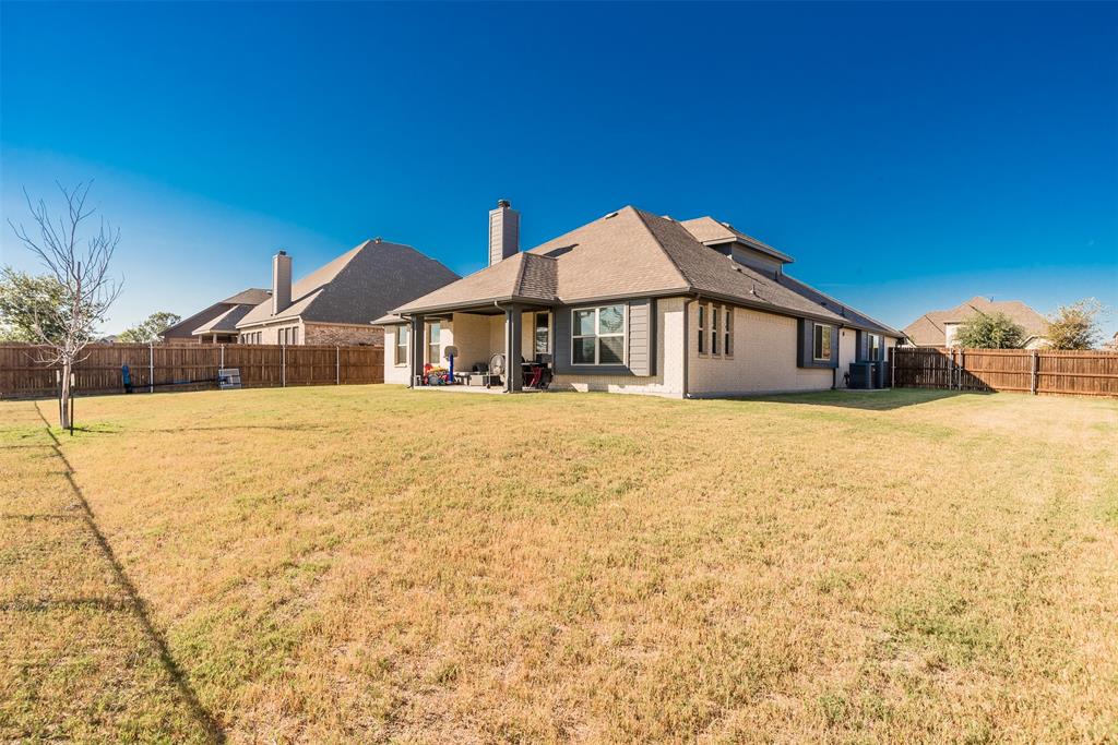 1566 Harrison Circle Waxahachie, TX 75165 - Photo 33 of 38 a front view of a house with a yard