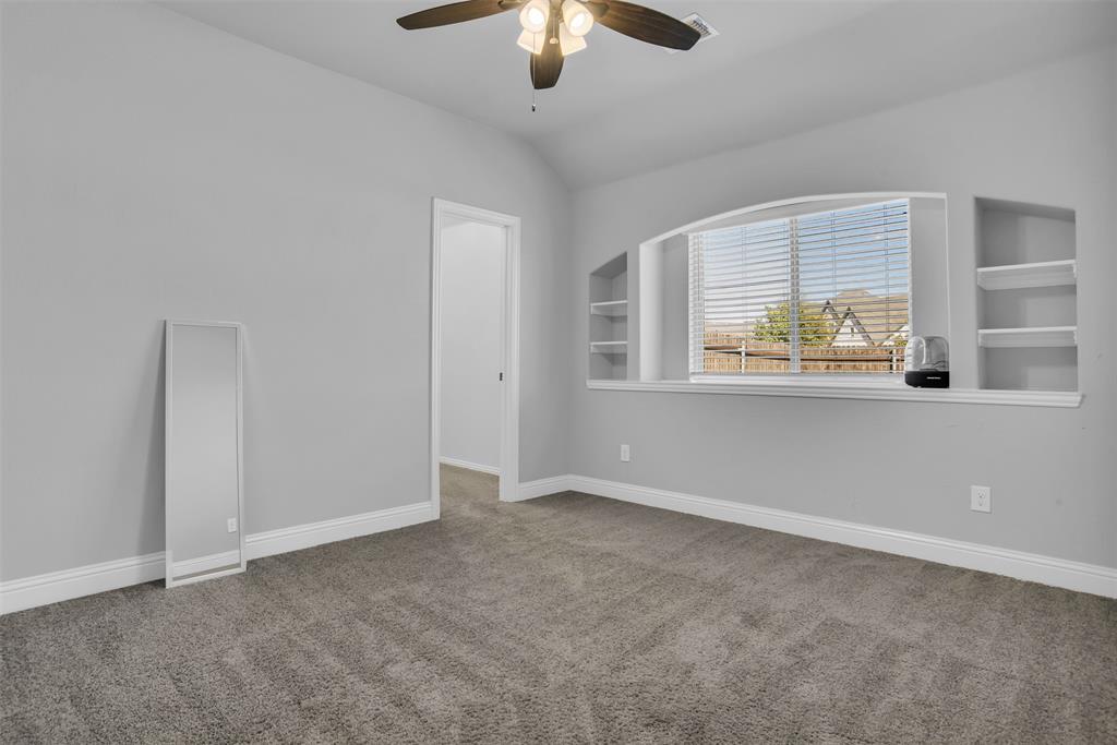 1566 Harrison Circle Waxahachie, TX 75165 - Photo 8 of 38 a view of an empty room with a window