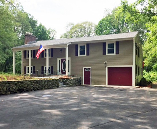93 Wheelock Road Sutton, MA 01590 - Photo 1 of 30 a front view of a house with a garden