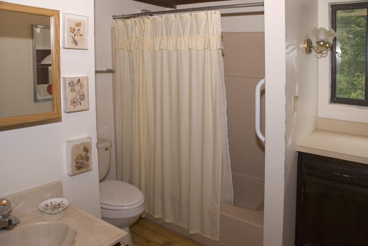 77 Stebbins Road Otis, MA 01253 - Photo 14 of 17 a bathroom with a toilet a sink and shower curtain