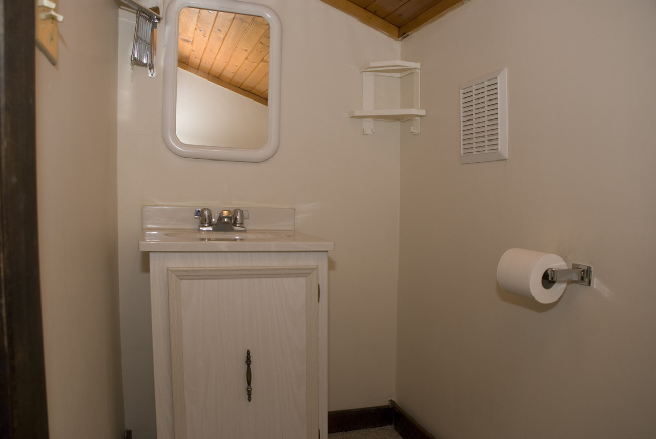 77 Stebbins Road Otis, MA 01253 - Photo 17 of 17 a bathroom with a sink a mirror and vanity