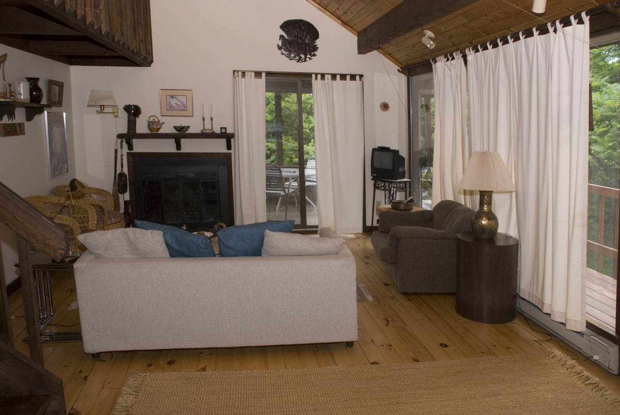77 Stebbins Road Otis, MA 01253 - Photo 7 of 17 a living room with furniture and a large window