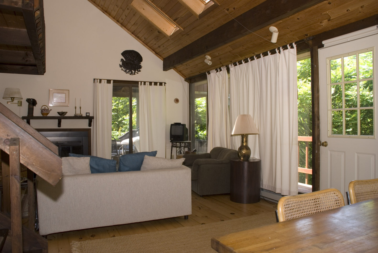77 Stebbins Road Otis, MA 01253 - Photo 8 of 17 a living room with furniture and a large window