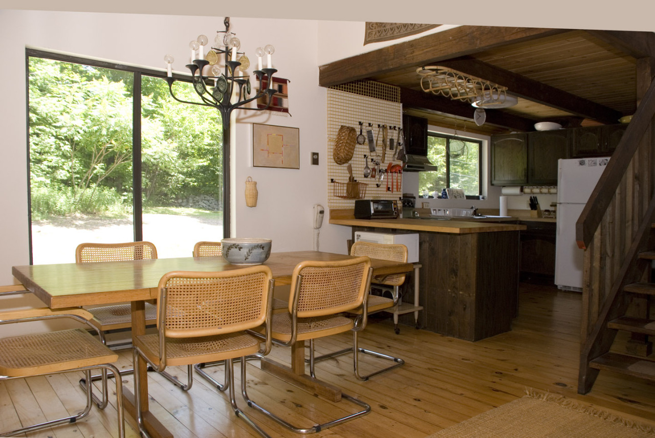 77 Stebbins Road Otis, MA 01253 - Photo 10 of 17 a dining room with wooden floor and large windows