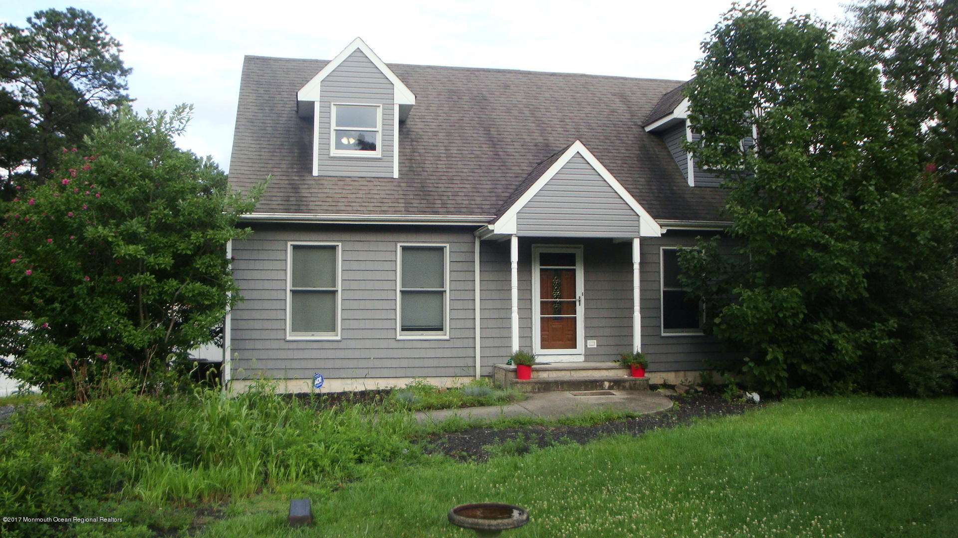 2323 Maple Road Forked River, NJ 08731 - Photo 1 of 23 a front view of a house with a yard and trees