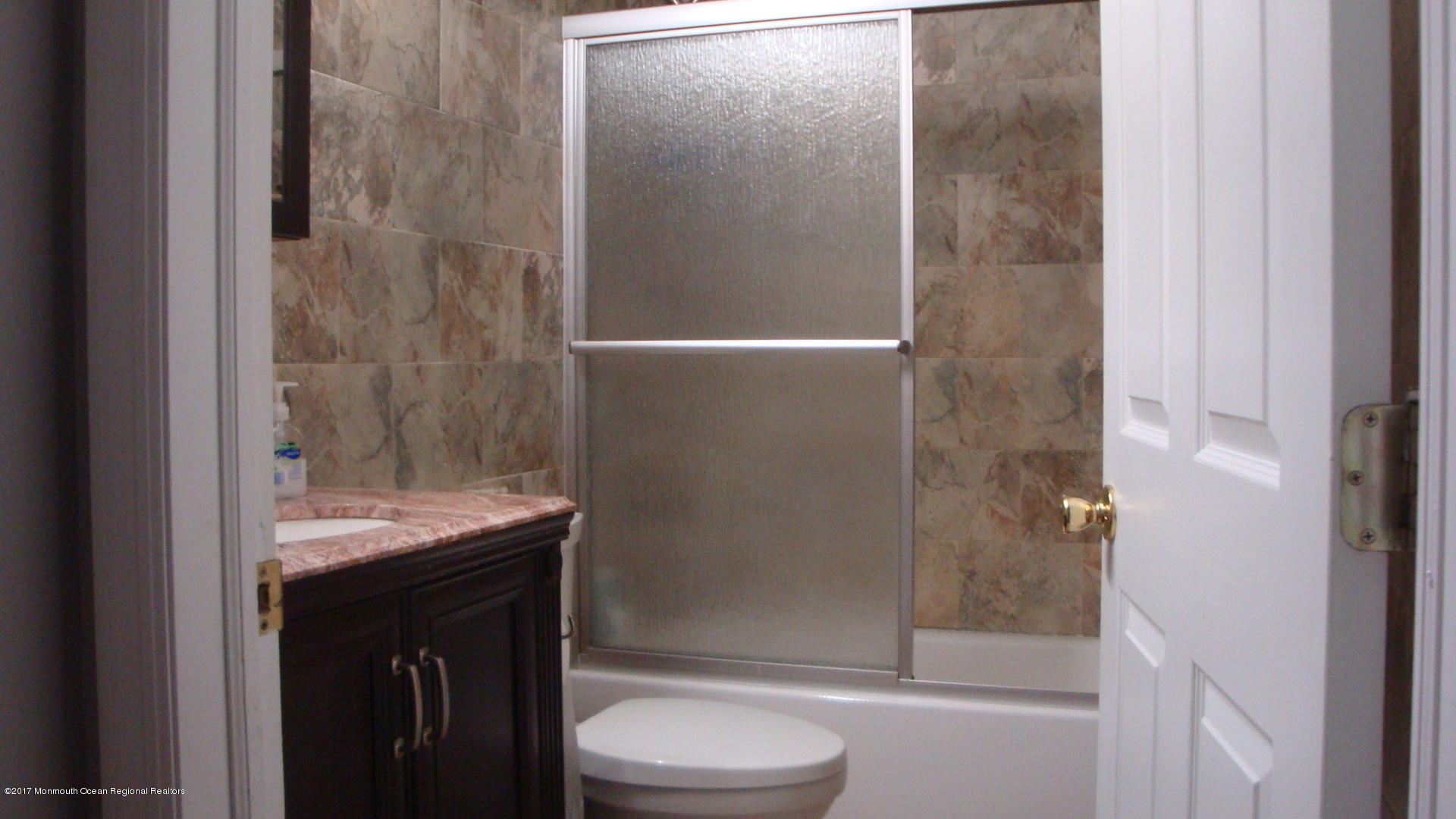 2323 Maple Road Forked River, NJ 08731 - Photo 12 of 23 a bathroom with a granite countertop bathtub shower sink vanity and toilet
