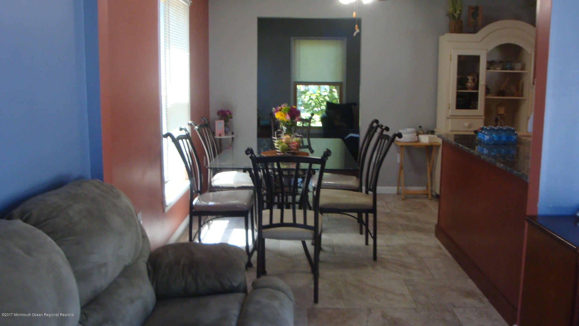 2323 Maple Road Forked River, NJ 08731 - Photo 5 of 23 a view of a dining room with furniture and a chandelier