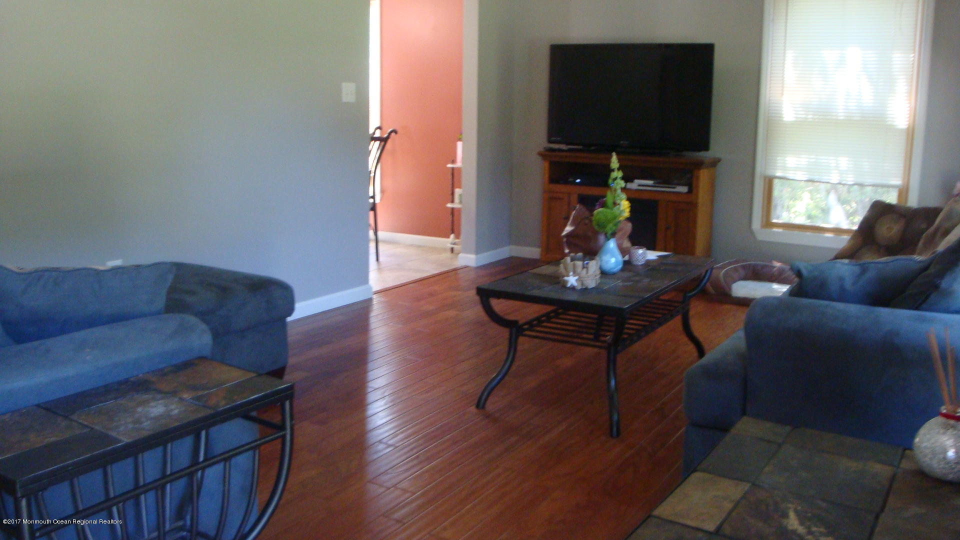 2323 Maple Road Forked River, NJ 08731 - Photo 9 of 23 a living room with furniture a flat screen tv and a window