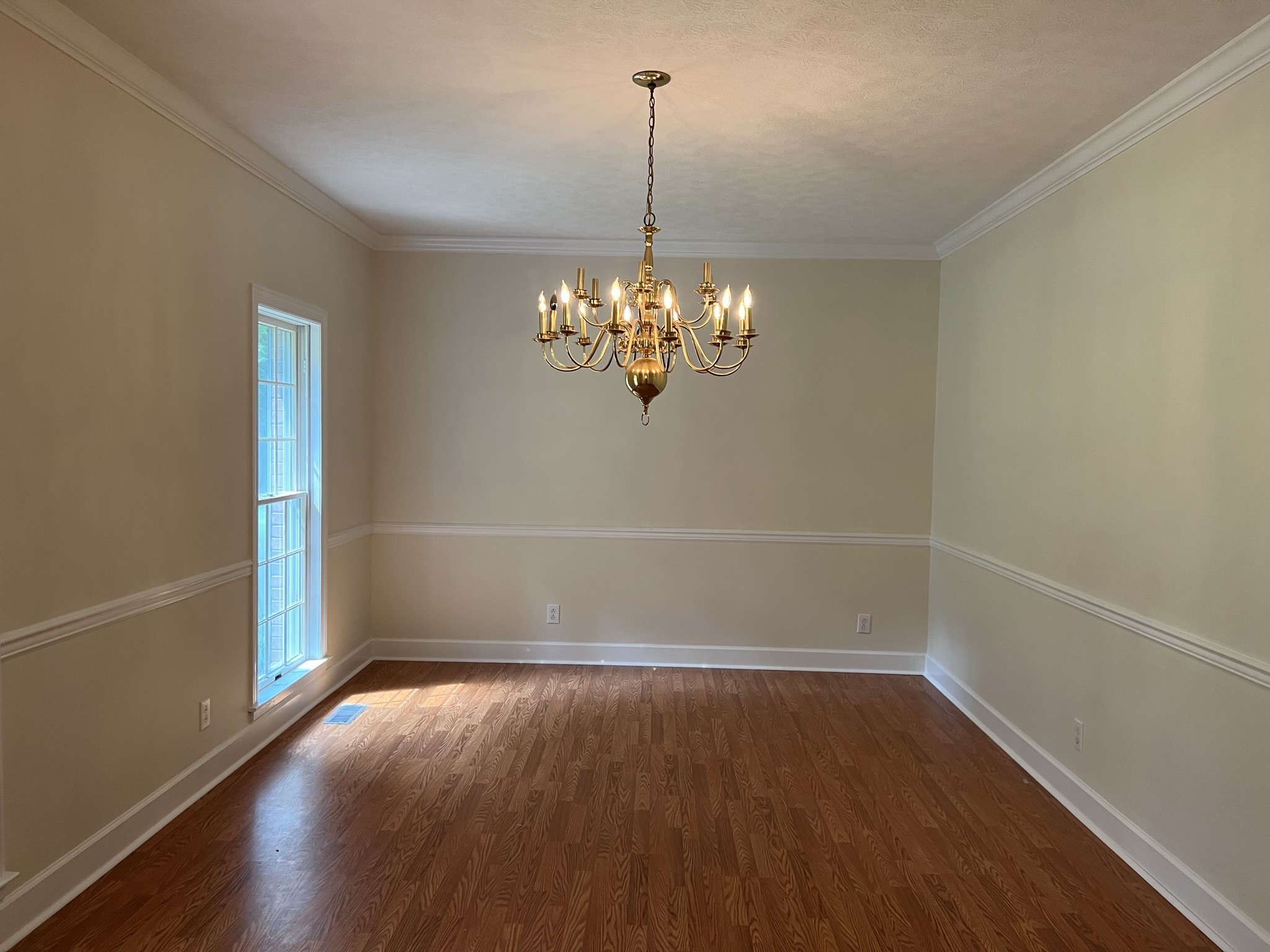 584 Corinth Road Portland, TN 37148 - Photo 14 of 42 a view of a room with wooden floor and chandelier